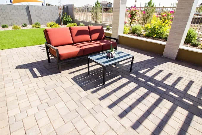 Paver patio set up as an outdoor lounge area